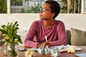 thoughtful-black-girl-eyewear-focused-aside-tries-gather-with-thoughts-300x200 About us.